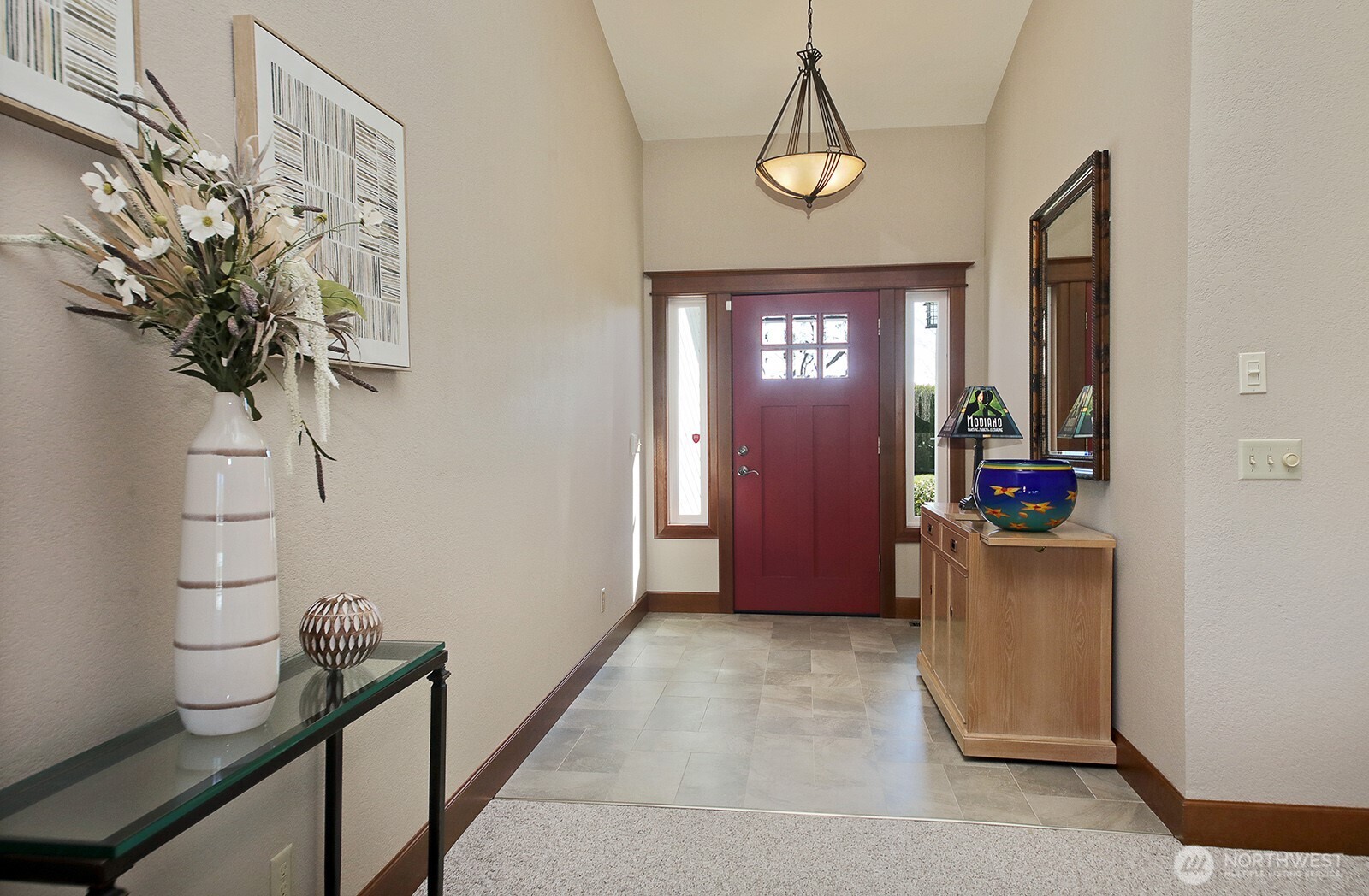 2471 Soundview Drive Langley, WA 98260 - Photo 11 of 38 a view of a hallway with paintings on the wall