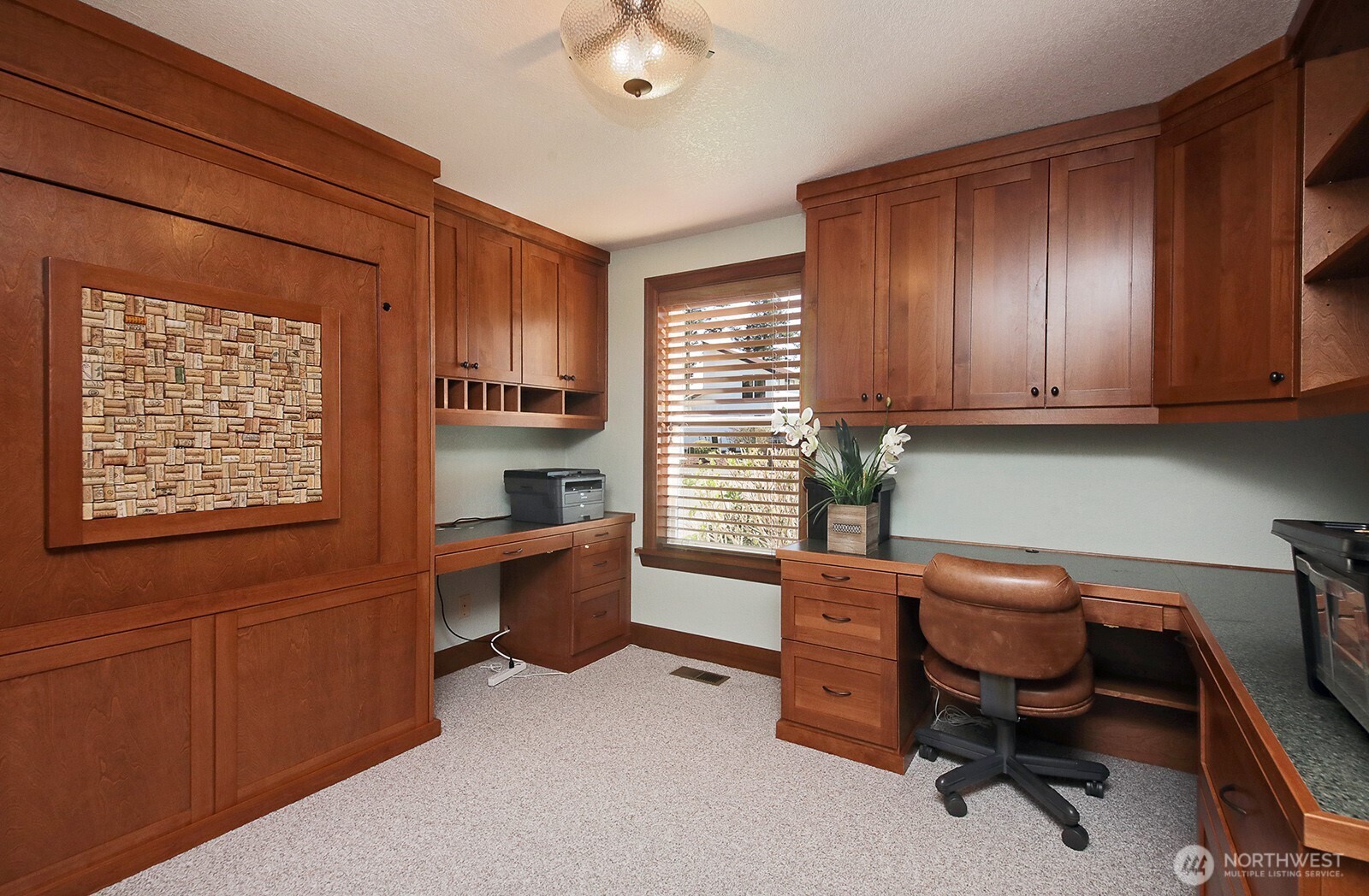 2471 Soundview Drive Langley, WA 98260 - Photo 17 of 38 a view of a workspace with furniture and a window