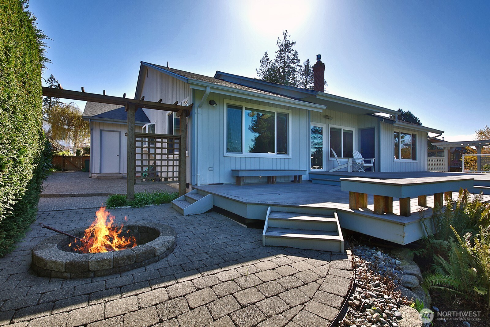 2471 Soundview Drive Langley, WA 98260 - Photo 27 of 38 a front view of a house with a yard balcony and outdoor seating