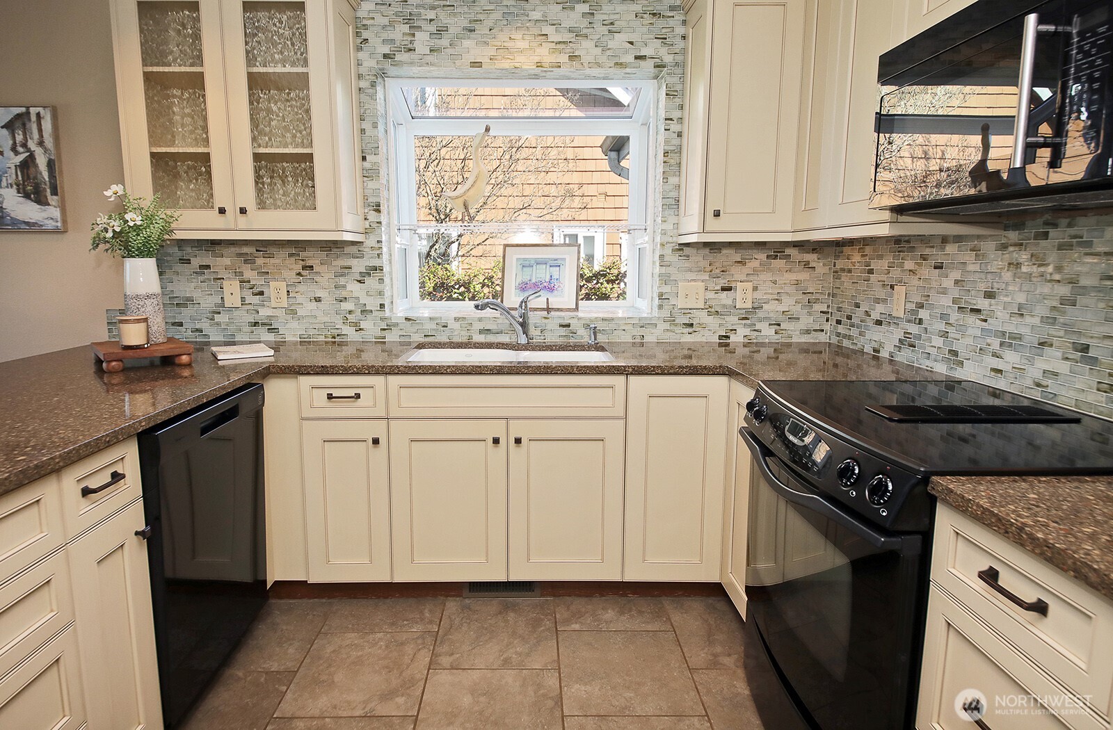 2471 Soundview Drive Langley, WA 98260 - Photo 9 of 38 a kitchen with granite countertop a sink stove and cabinets