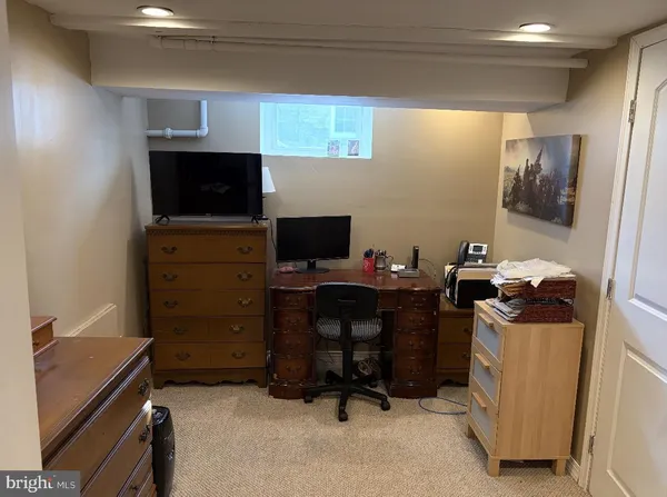a view of a workspace with furniture