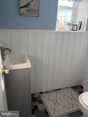 a bathroom with a sink and toilet