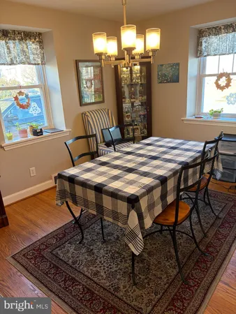 a outdoor dining space with furniture and window
