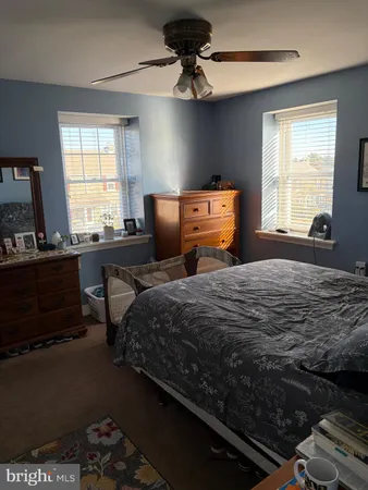 a bedroom with bed and window