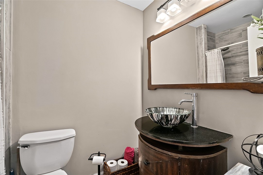 481 Warren Street Sebastian, FL 32958 - Photo 24 of 33 a bathroom with a toilet and a sink