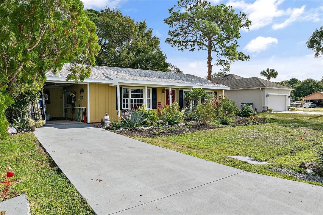 481 Warren Street Sebastian, FL 32958 - Photo 8 of 33 a front view of a house with garden