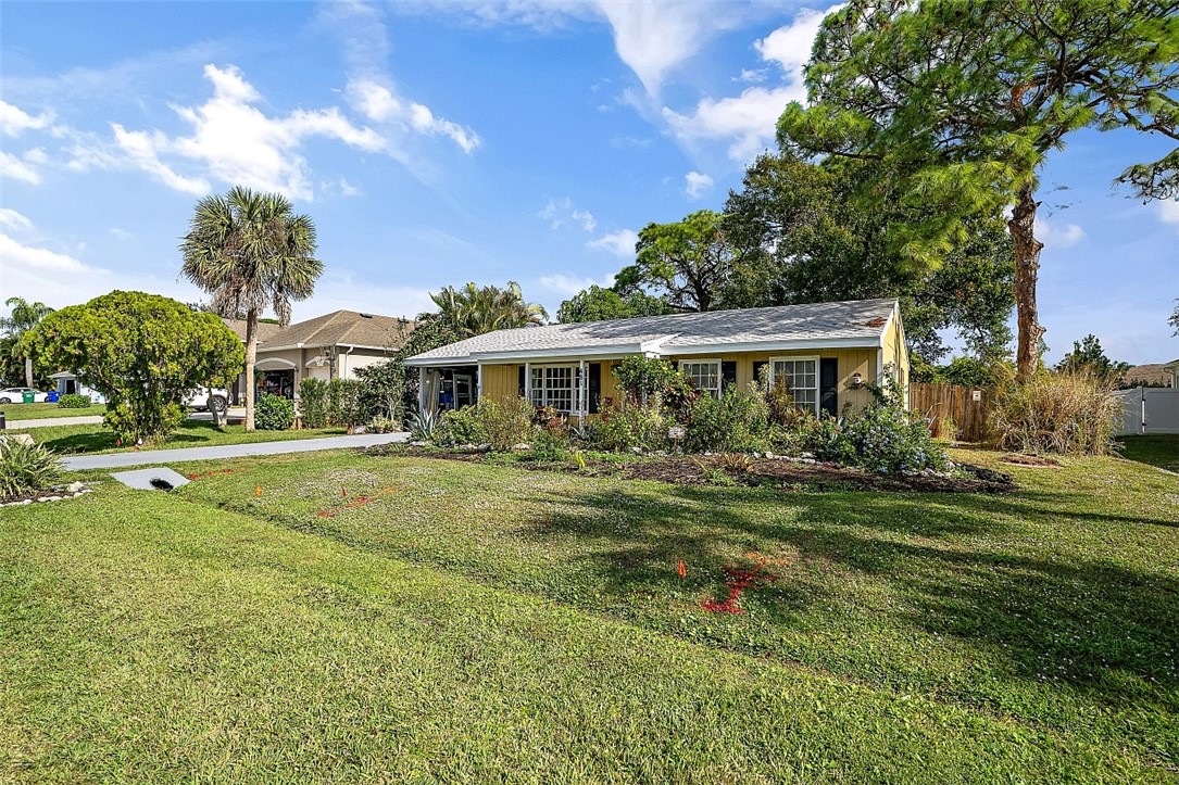481 Warren Street Sebastian, FL 32958 - Photo 9 of 33 a front view of a house with a yard