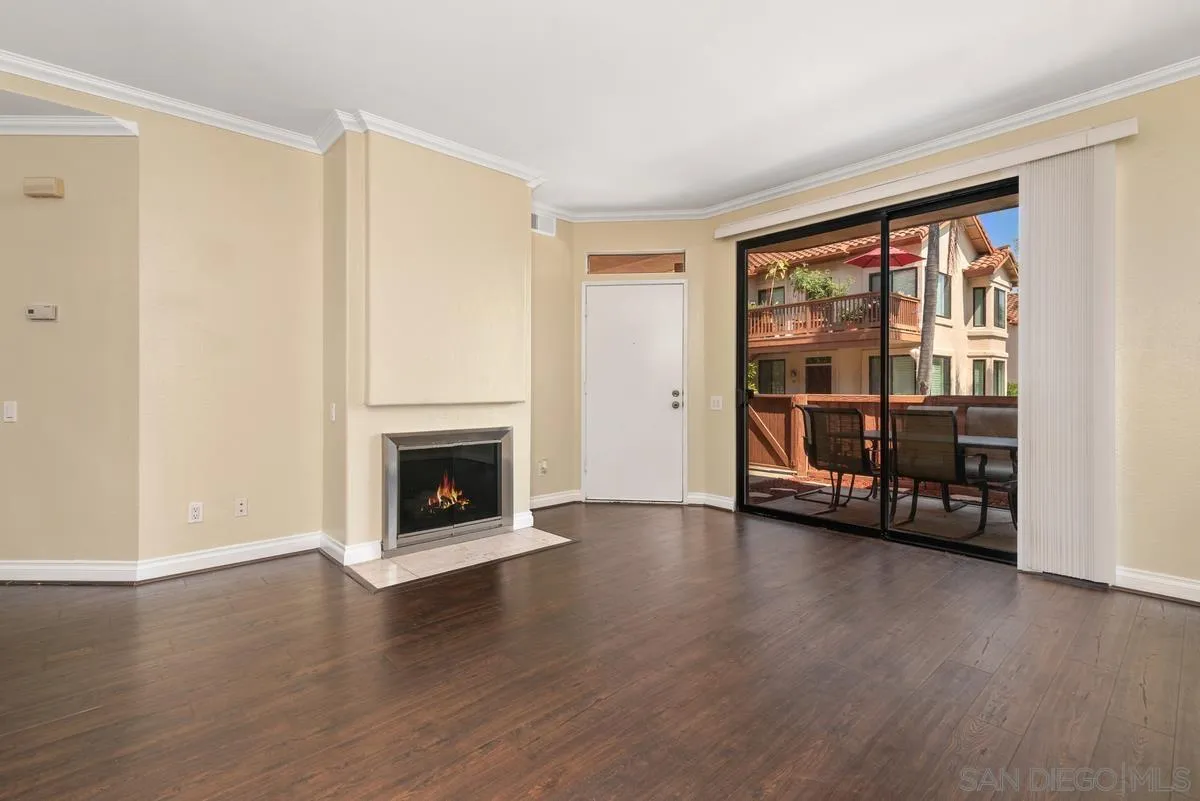 4049 Carmel View Road, Unit 75 San Diego, CA 92130 - Photo 4 of 13 a view of an empty room with window and a fireplace