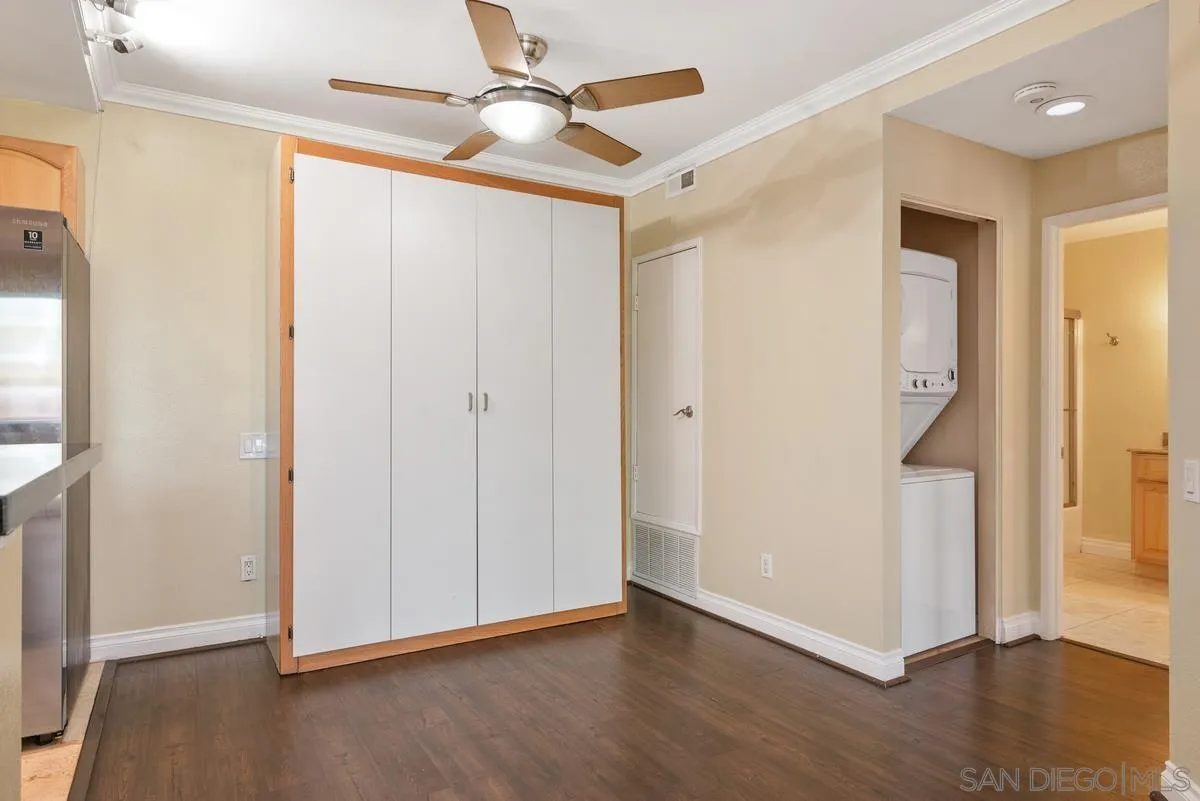 4049 Carmel View Road, Unit 75 San Diego, CA 92130 - Photo 6 of 13 a view of an empty room with wooden floor