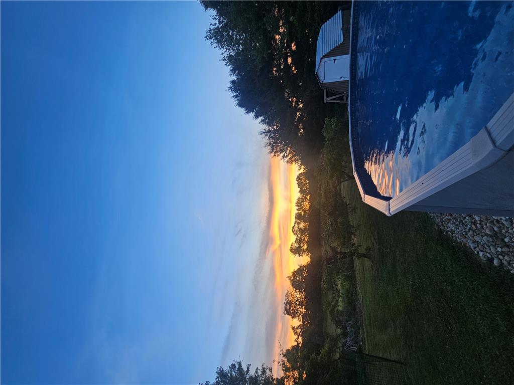 4065 Airport Road Allentown, PA 18109 - Photo 26 of 28 Sunset views over the surrounding landscape, with a refreshing pool for evening relaxation.