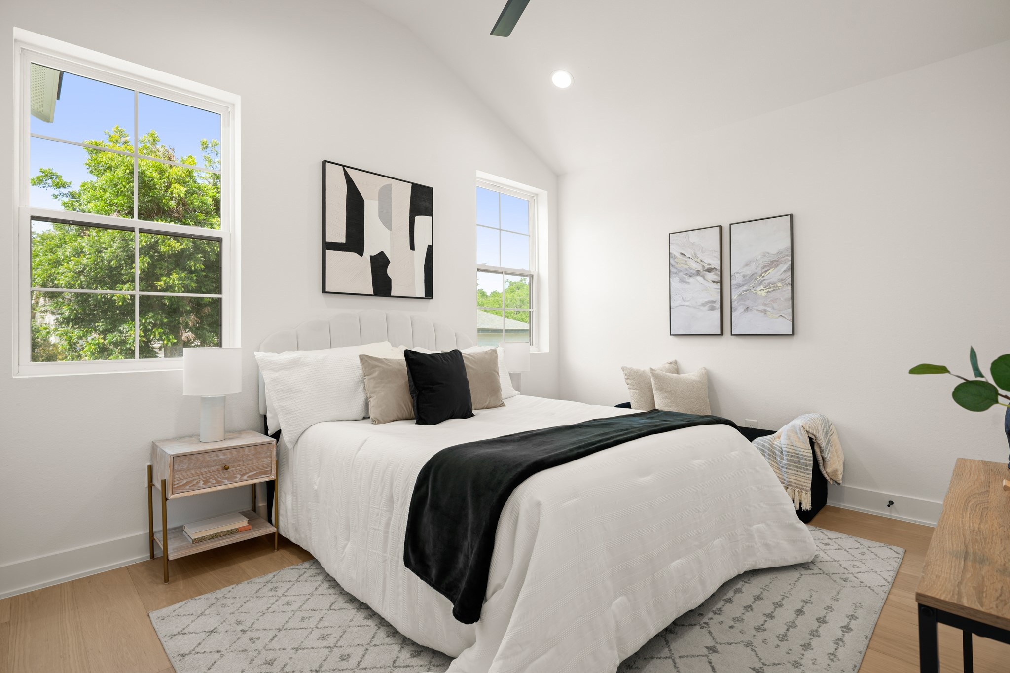 601 Vermont Road, Unit 2 Austin, TX 78702 - Photo 17 of 31 A tranquil bedroom retreat features soaring vaulted ceilings and abundant natural light.
