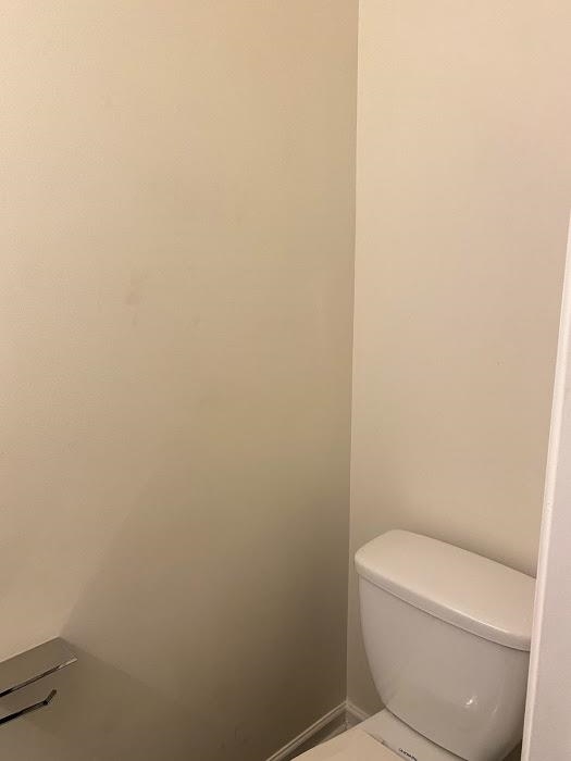 1630 Tigris Court Atlanta, GA 30349 - Photo 16 of 33 a white toilet sitting next to a white wall