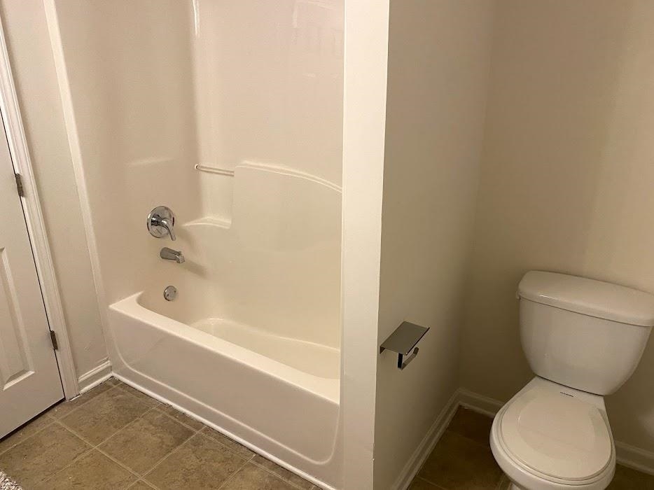 1630 Tigris Court Atlanta, GA 30349 - Photo 21 of 33 a bathroom with a toilet and a bath tub