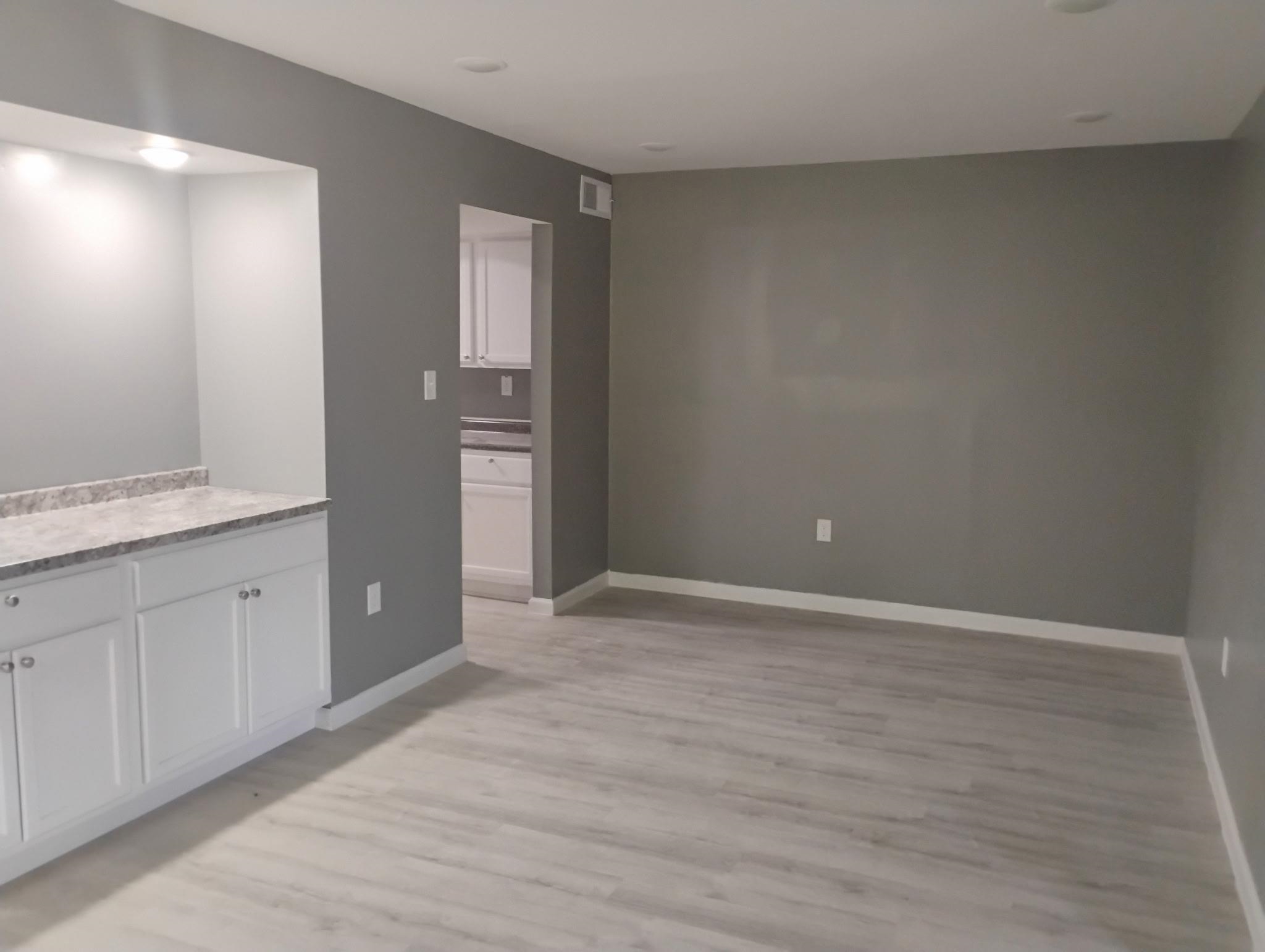 3340 Kirby Trees Place, Unit 3340 Memphis, TN 38115 - Photo 4 of 16 Interior space featuring white cabinets, light wood-style floors, and light countertops