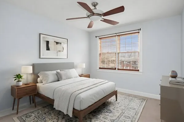 a bedroom with a bed and a window