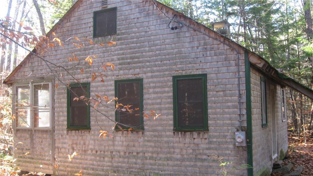 305 Fosterville Road Bridgton, ME 04009 - Photo 1 of 8 Side view of the camp. Enclosed...