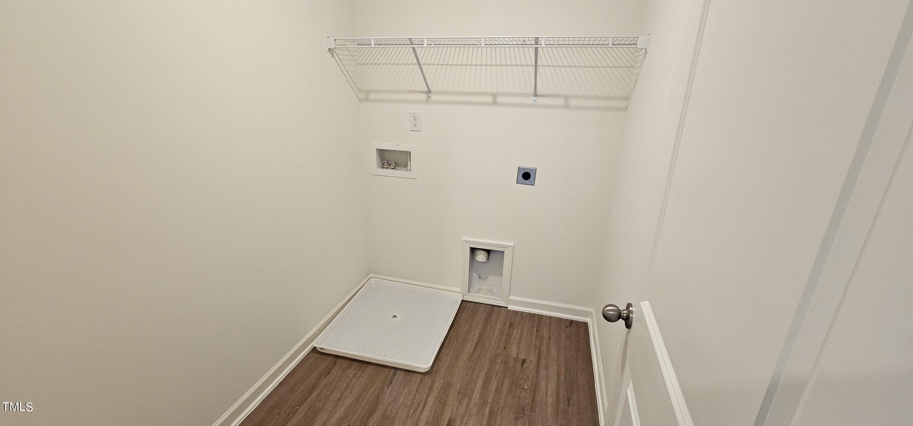 1409 Underbrush Drive Durham, NC 27703 - Photo 13 of 21 a view of a room with wooden floor and cabinet