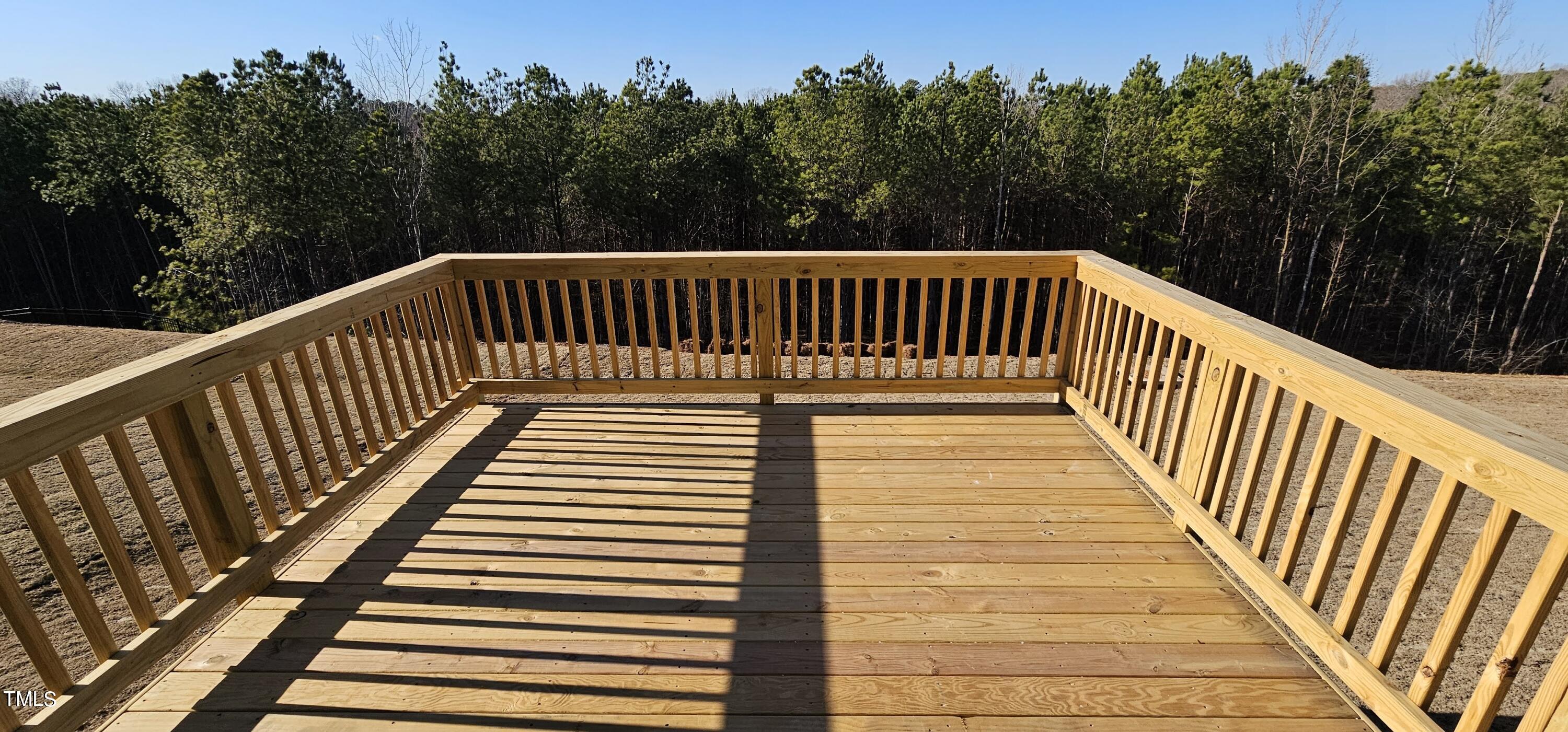 1409 Underbrush Drive Durham, NC 27703 - Photo 14 of 21 a view of balcony with wooden floor and trees in the background