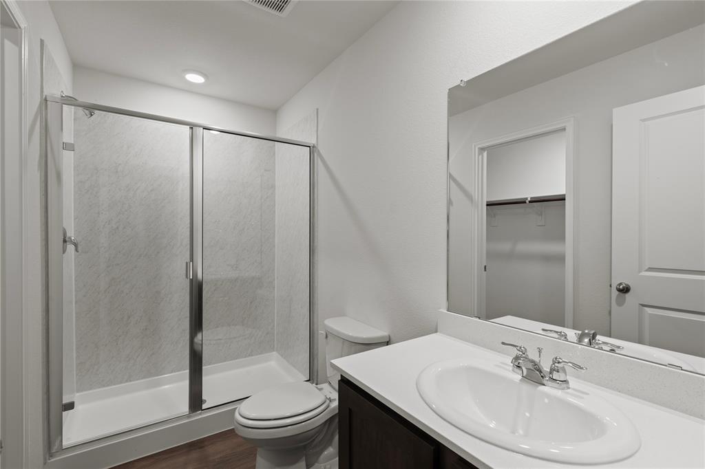 7016 Vining Drive Princeton, TX 75407 - Photo 11 of 22 a bathroom with a sink toilet and shower