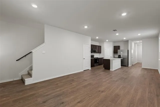 a view of kitchen with wooden floor