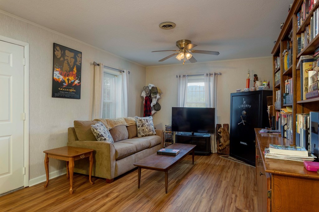 9068 Rhea County Highway Dayton, TN 37321 - Photo 21 of 34 a living room with furniture a flat screen tv and kitchen view