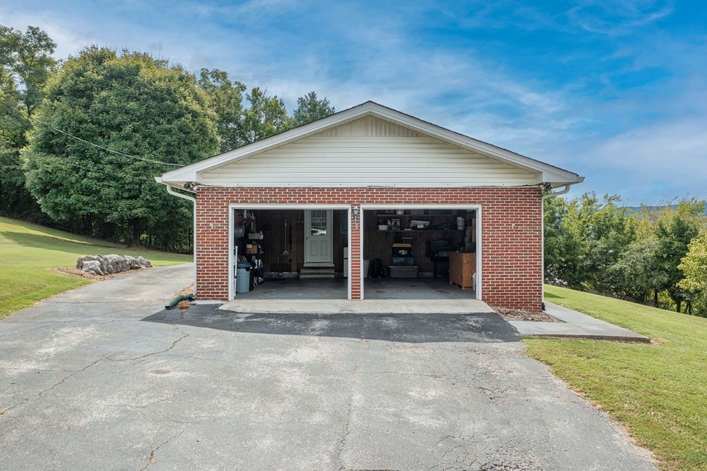 9068 Rhea County Highway Dayton, TN 37321 - Photo 31 of 34 a view of a house with backyard and garden