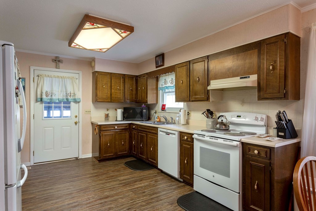 9068 Rhea County Highway Dayton, TN 37321 - Photo 8 of 34 a kitchen with a sink stove top oven and refrigerator