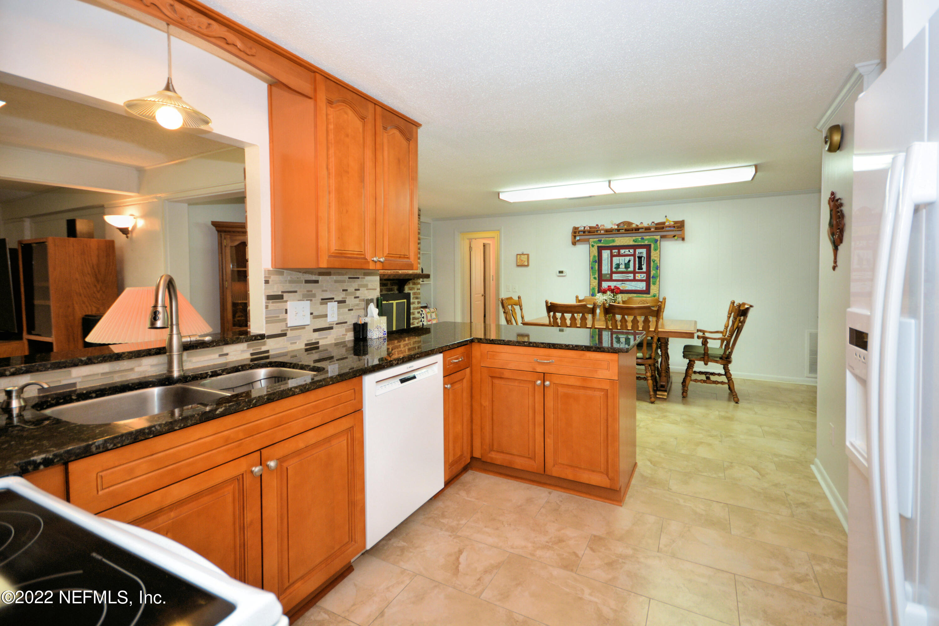 2282 Marcel Drive Orange Park, FL 32073 - Photo 11 of 29 a kitchen with stainless steel appliances granite countertop sink and cabinets