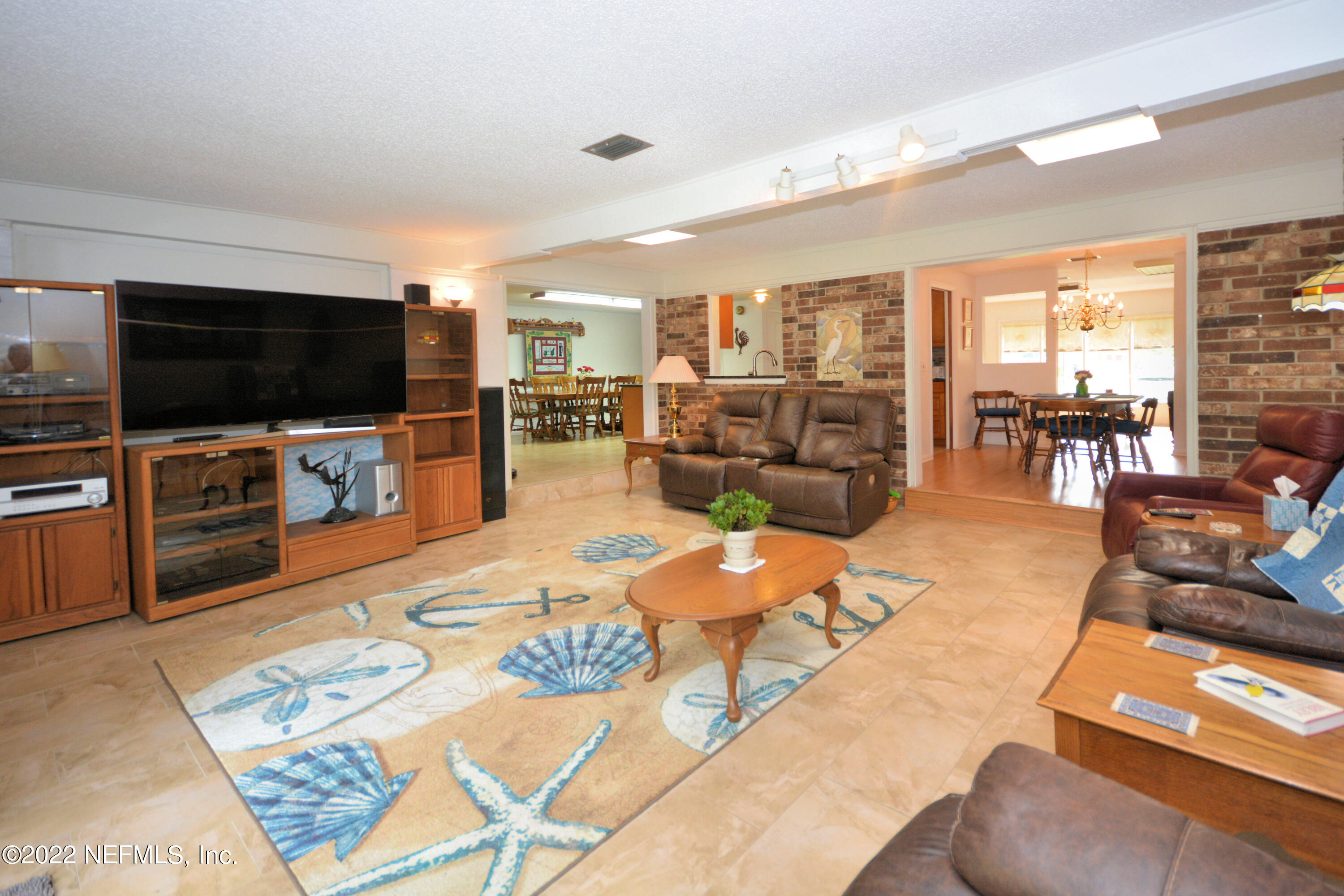 2282 Marcel Drive Orange Park, FL 32073 - Photo 14 of 29 a living room with furniture and a flat screen tv