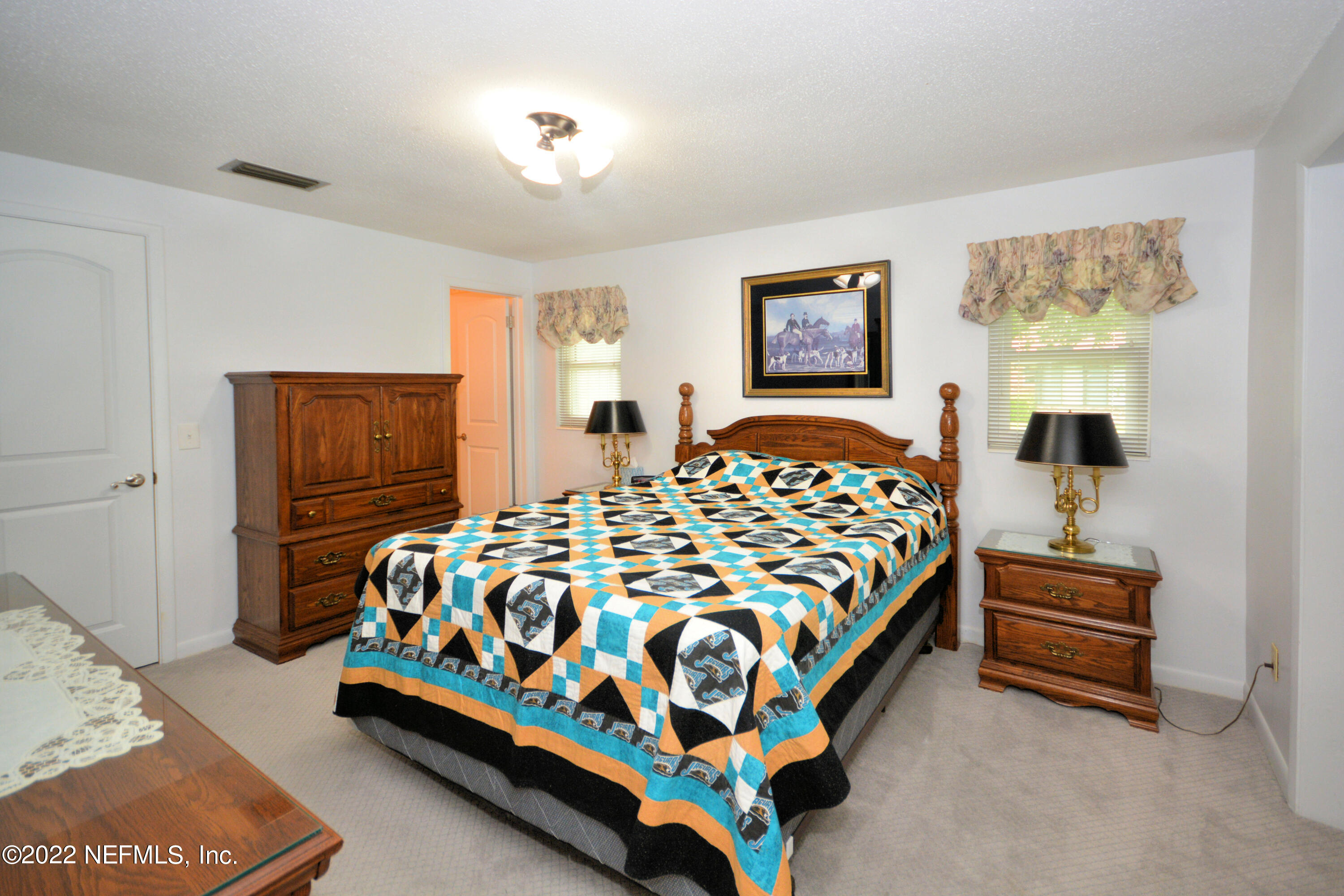 2282 Marcel Drive Orange Park, FL 32073 - Photo 15 of 29 a bedroom with a bed and window