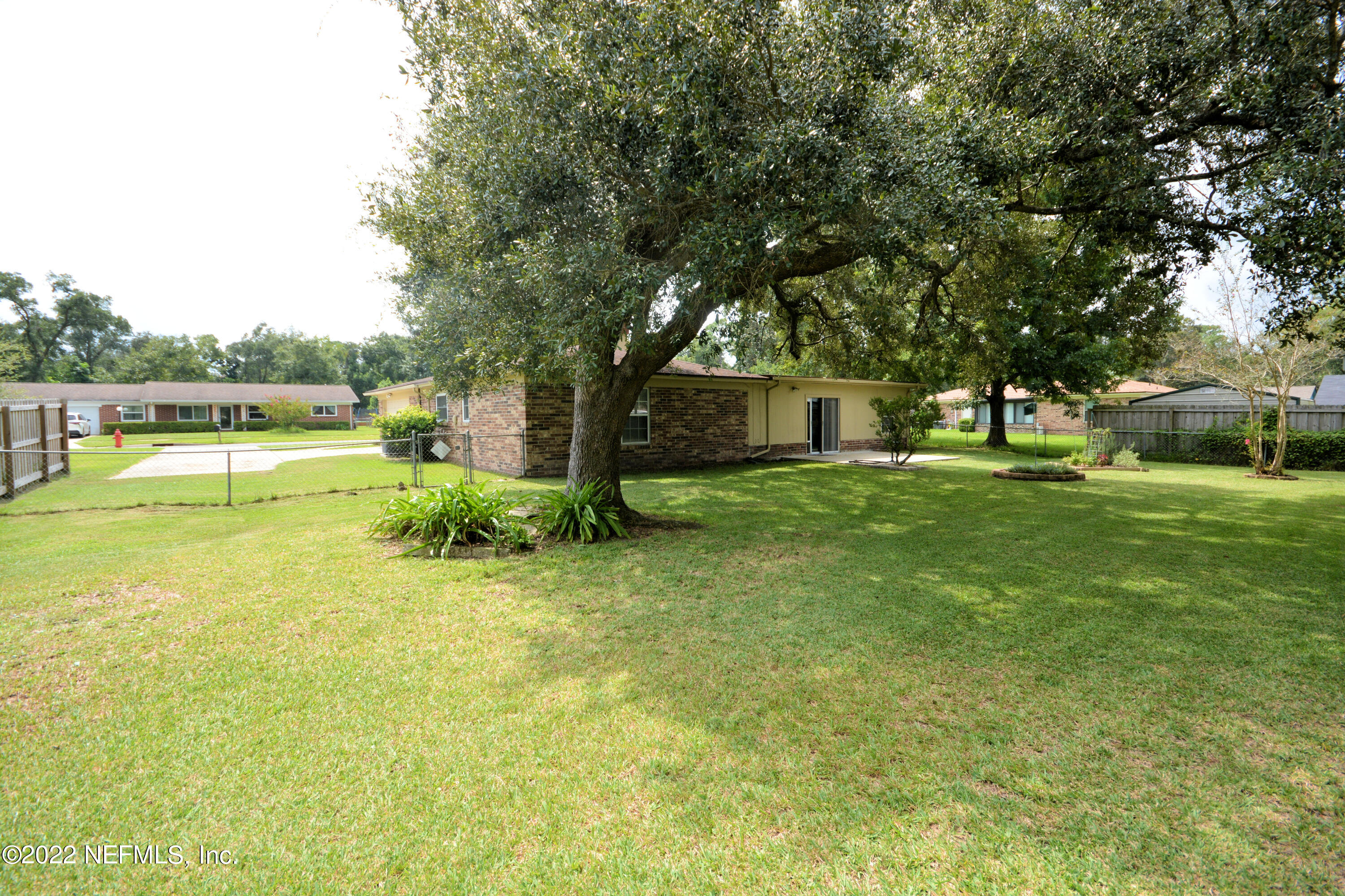 2282 Marcel Drive Orange Park, FL 32073 - Photo 28 of 29 a swimming pool with outdoor seating and yard