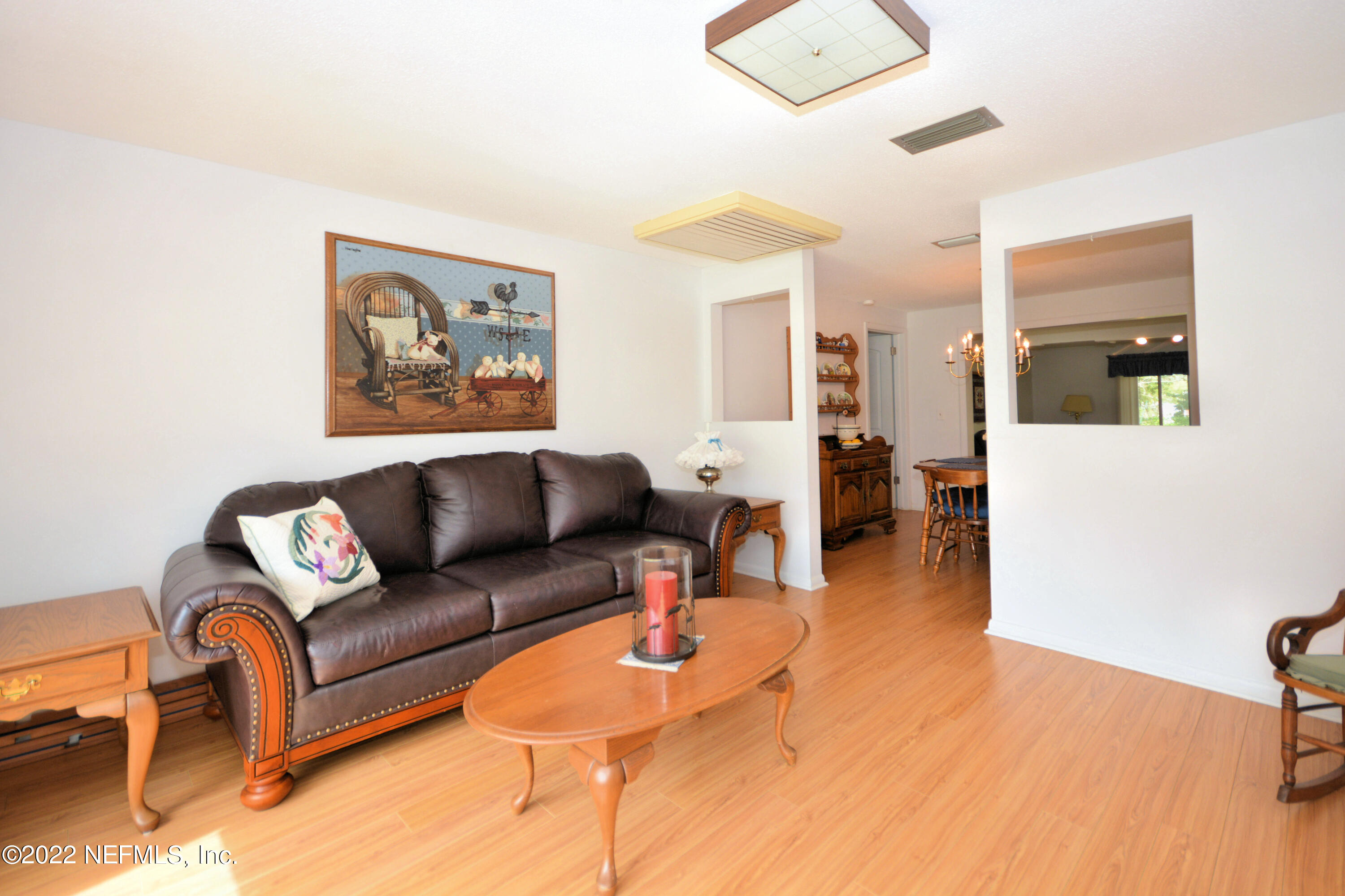 2282 Marcel Drive Orange Park, FL 32073 - Photo 5 of 29 a living room with furniture and wooden floor