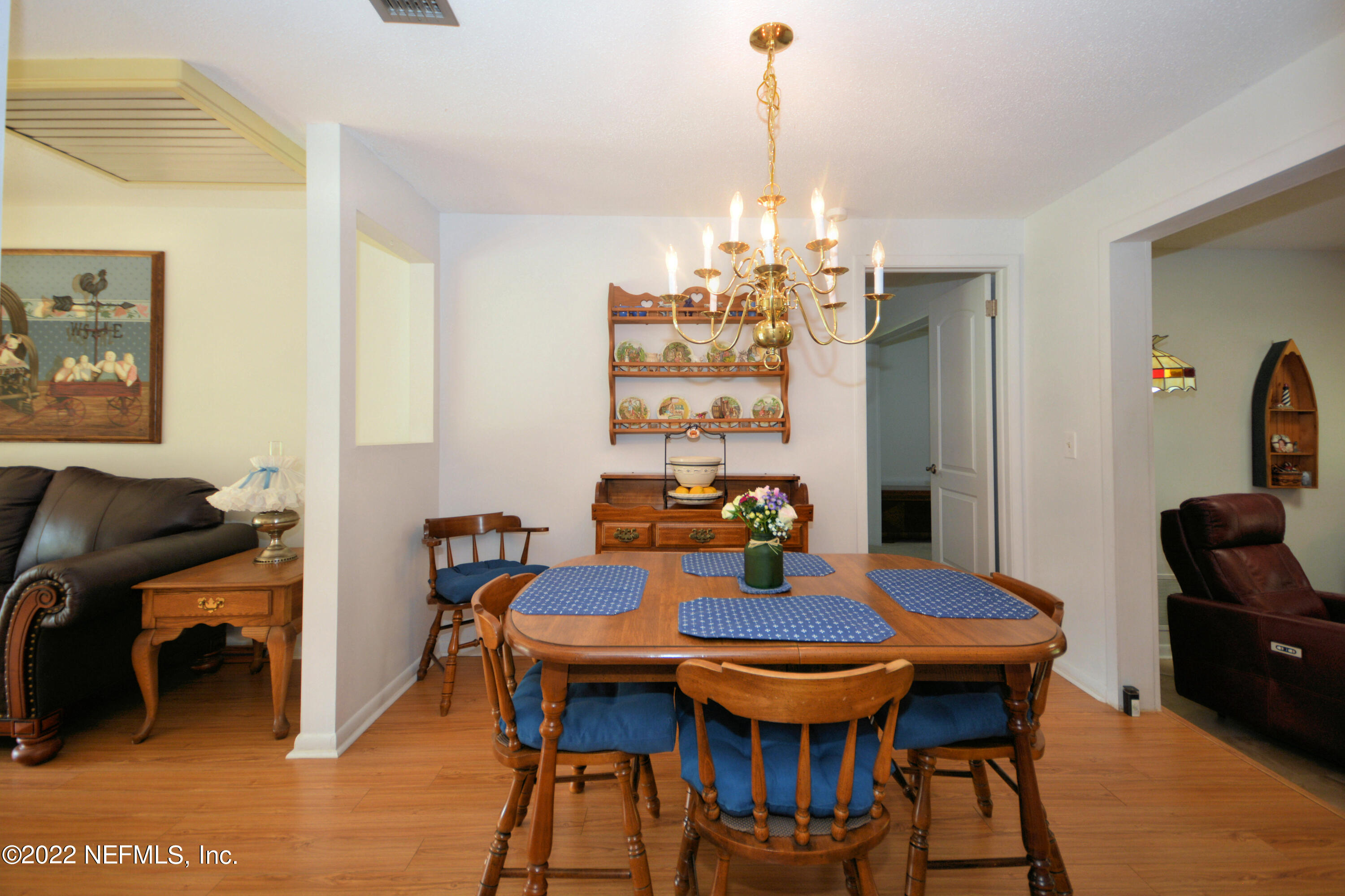 2282 Marcel Drive Orange Park, FL 32073 - Photo 7 of 29 a view of a dining room with furniture window and wooden floor