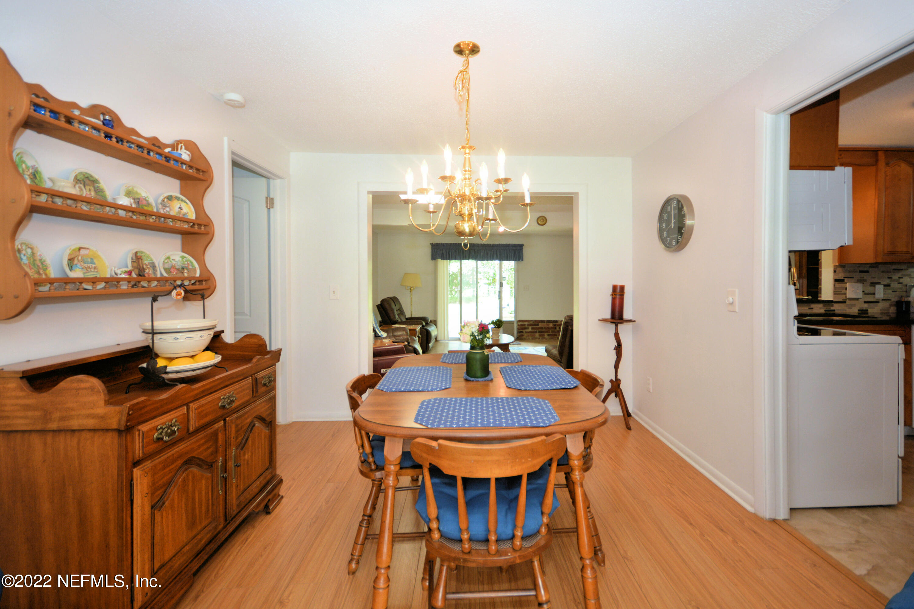 2282 Marcel Drive Orange Park, FL 32073 - Photo 8 of 29 a view of a dining room with furniture and wooden floor