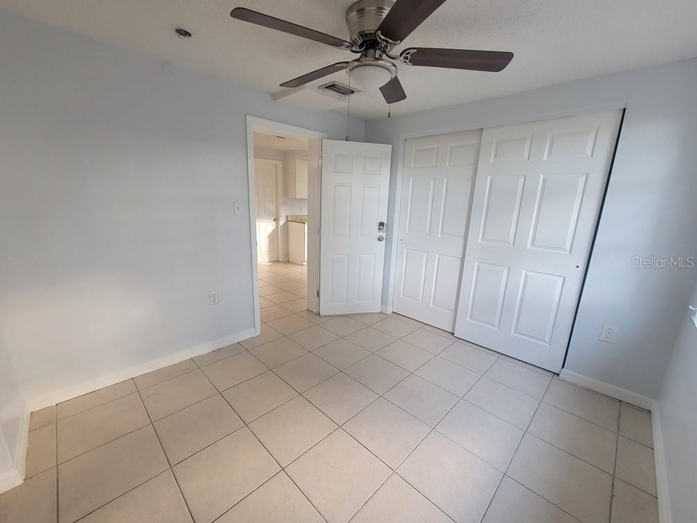 1415 Wickham Lane Holiday, FL 34691 - Photo 13 of 17 a view of an empty room and a fan