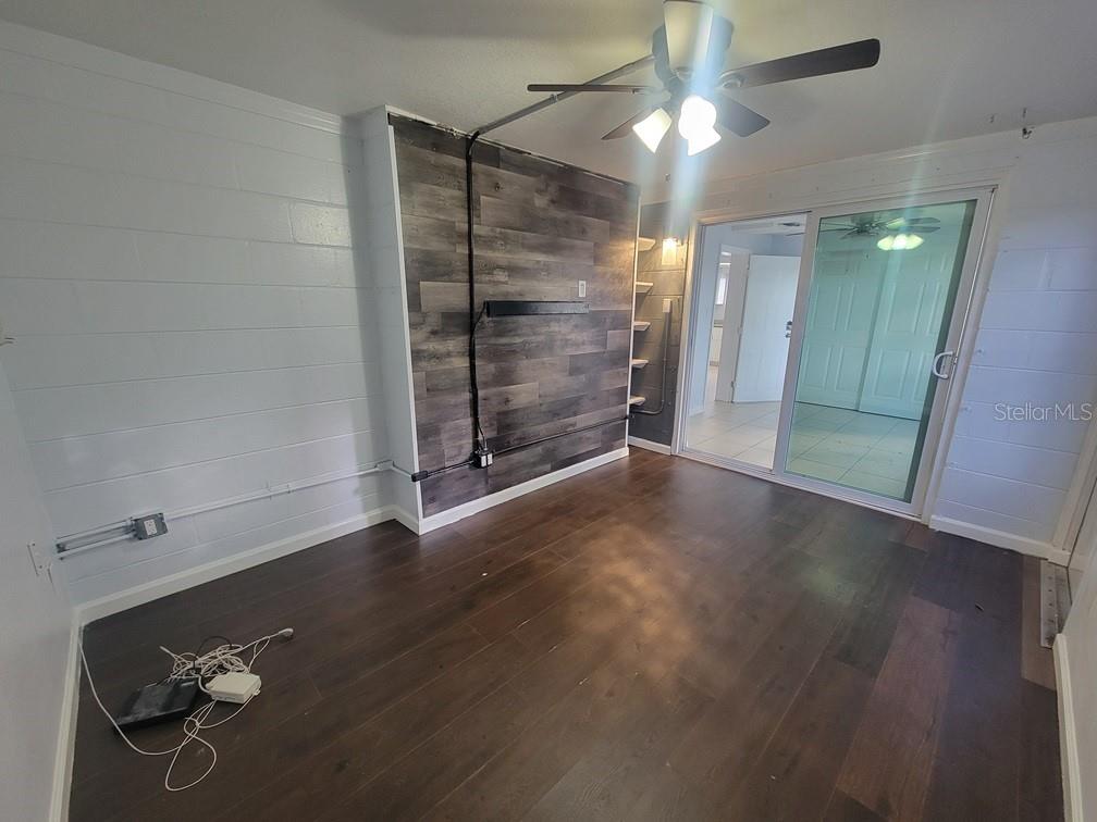 1415 Wickham Lane Holiday, FL 34691 - Photo 15 of 17 a view of empty room with wooden floor