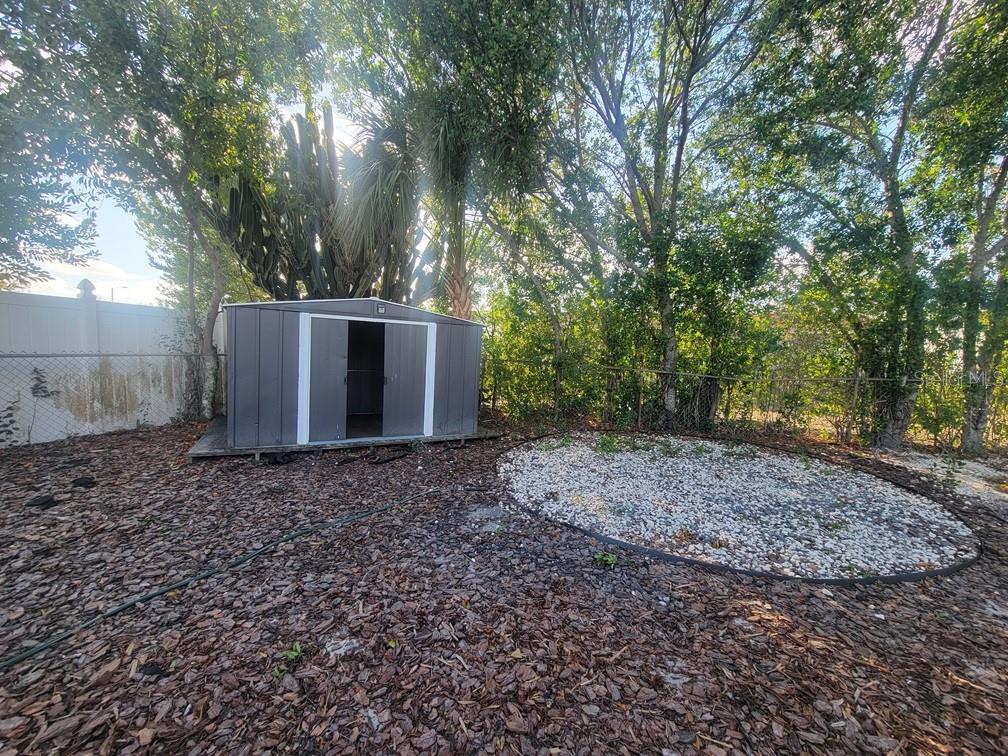 1415 Wickham Lane Holiday, FL 34691 - Photo 17 of 17 a view of a house with a yard