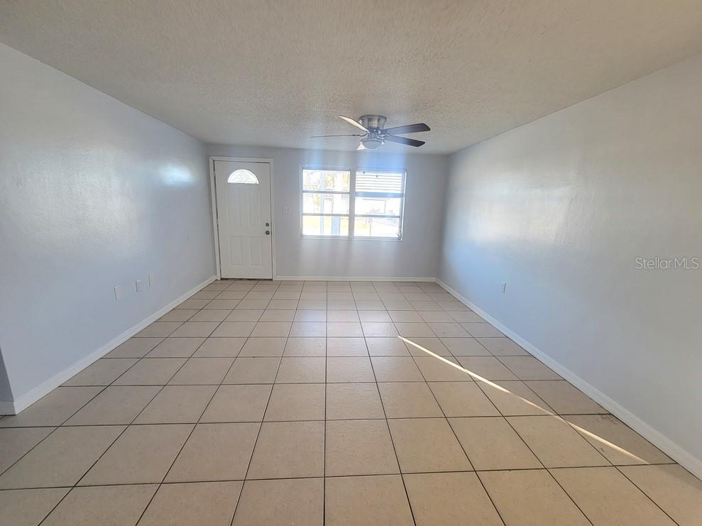 1415 Wickham Lane Holiday, FL 34691 - Photo 2 of 17 a view of an empty room and window