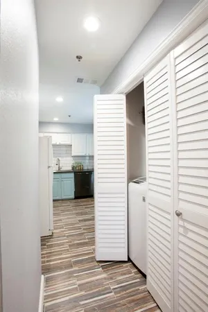 a view of a kitchen from the hallway