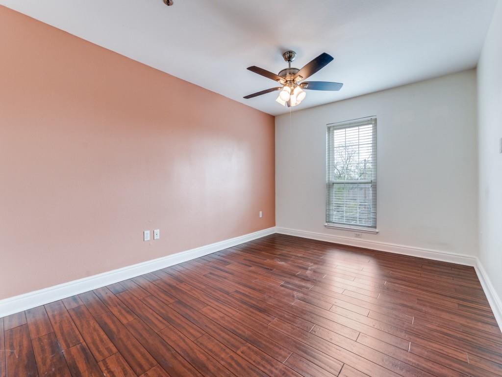 5407 Bryan Street, Unit B209 Dallas, TX 75206 - Photo 16 of 25 a view of an empty room with wooden floor and a window
