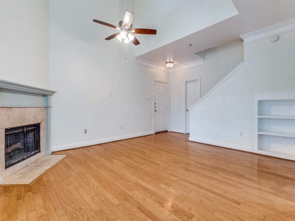 5407 Bryan Street, Unit B209 Dallas, TX 75206 - Photo 4 of 25 a view of empty room with wooden floor and fireplace