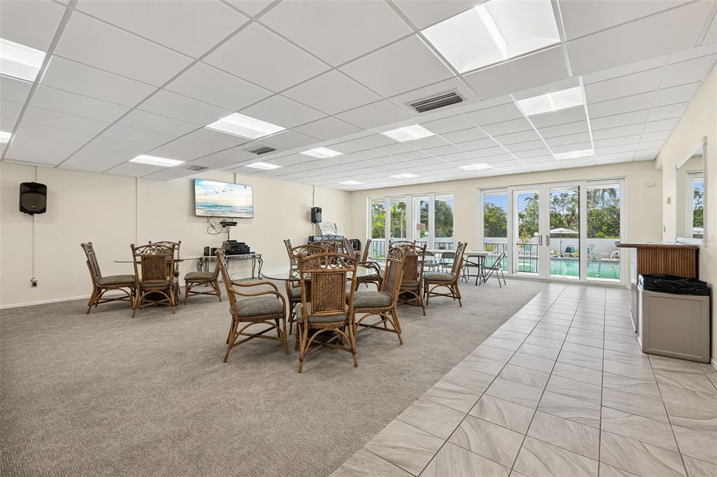 6415 Midnight Pass Road, Unit 211 Sarasota, FL 34242 - Photo 37 of 58 a lobby with furniture and view kitchen