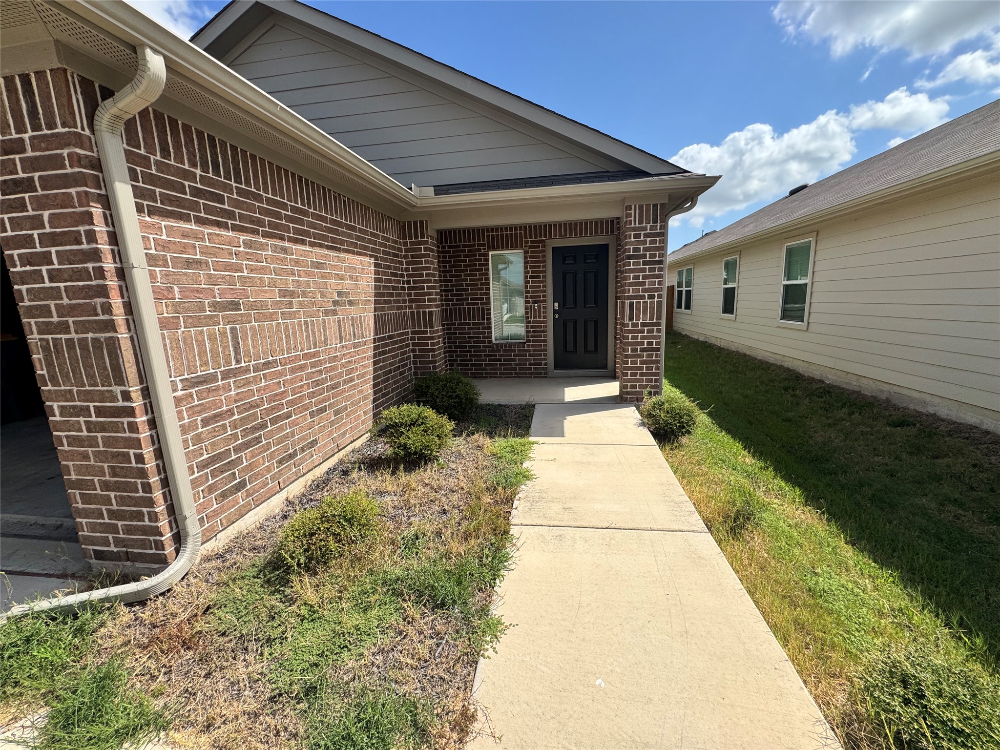 11820 Rush Lane Elgin, TX 78621 - Photo 2 of 31 A well-maintained brick exterior offers inviting curb appeal.