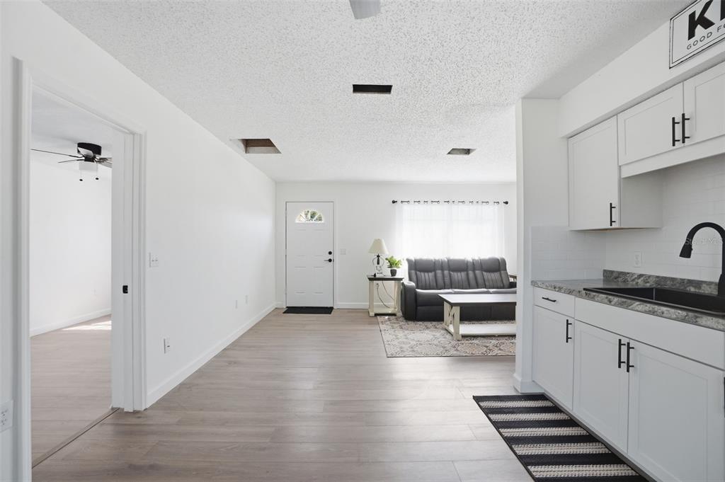 2076 Landover Boulevard Spring Hill, FL 34608 - Photo 16 of 37 a kitchen with a sink and a stove top oven
