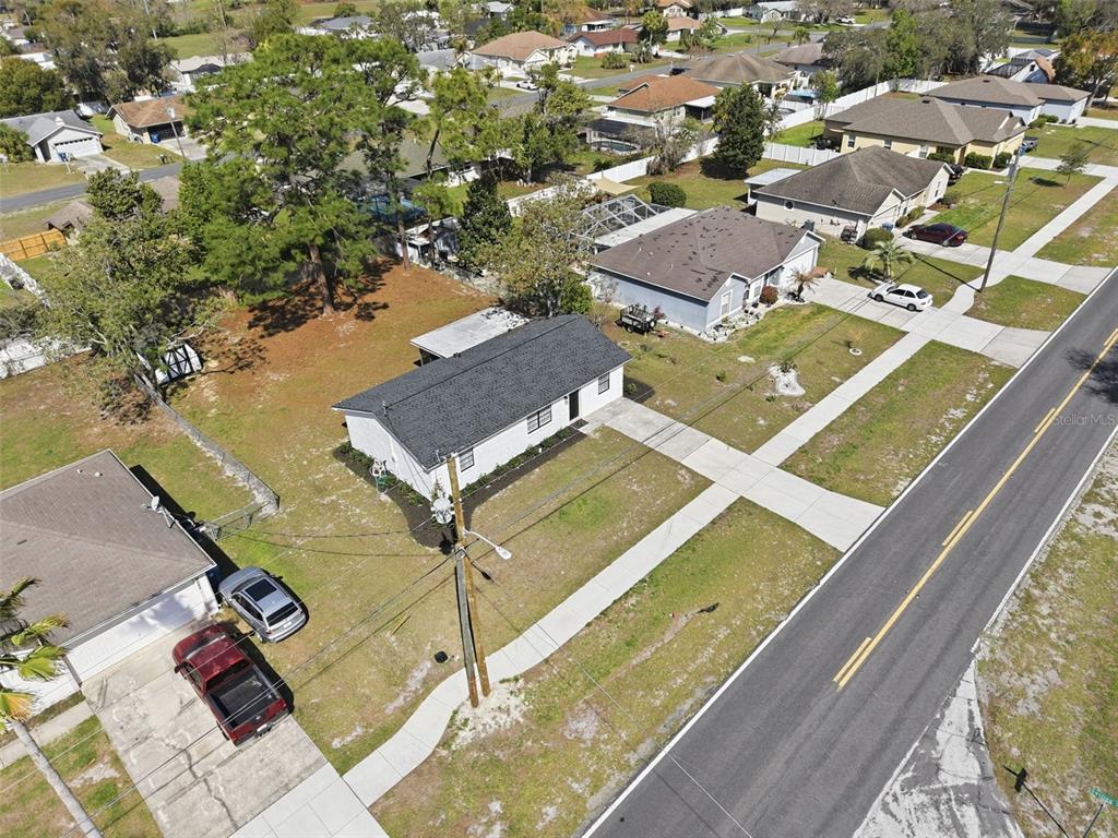 2076 Landover Boulevard Spring Hill, FL 34608 - Photo 30 of 37 an aerial view of residential houses with outdoor space