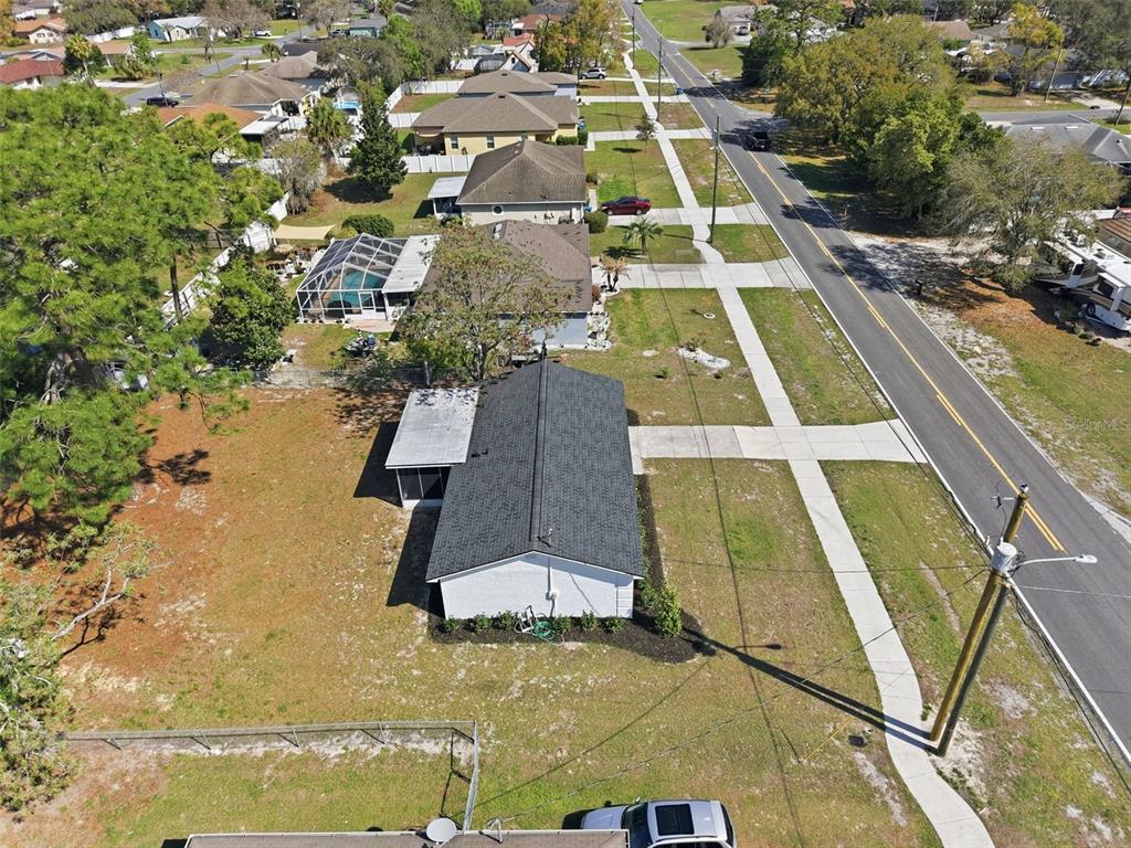 2076 Landover Boulevard Spring Hill, FL 34608 - Photo 31 of 37 an aerial view of residential houses with yard
