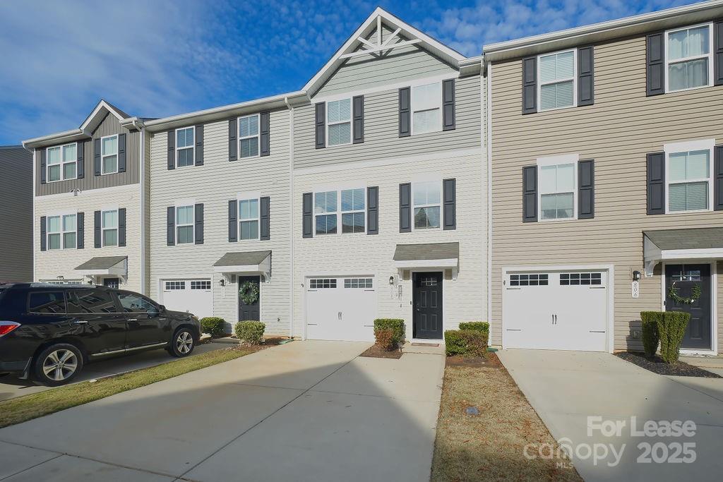 a view of a car parked in front of a building