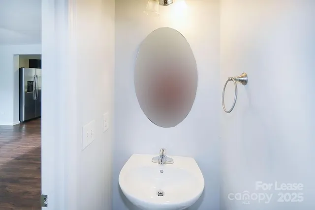 a bathroom with a sink and mirror