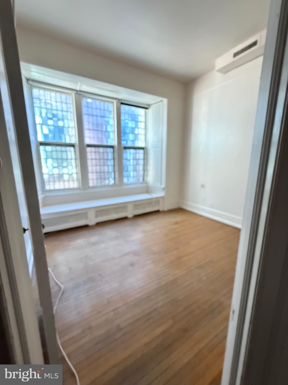 1720 Spruce Street, Unit 5 Philadelphia, PA 19103 - Photo 14 of 24 an empty room with a window