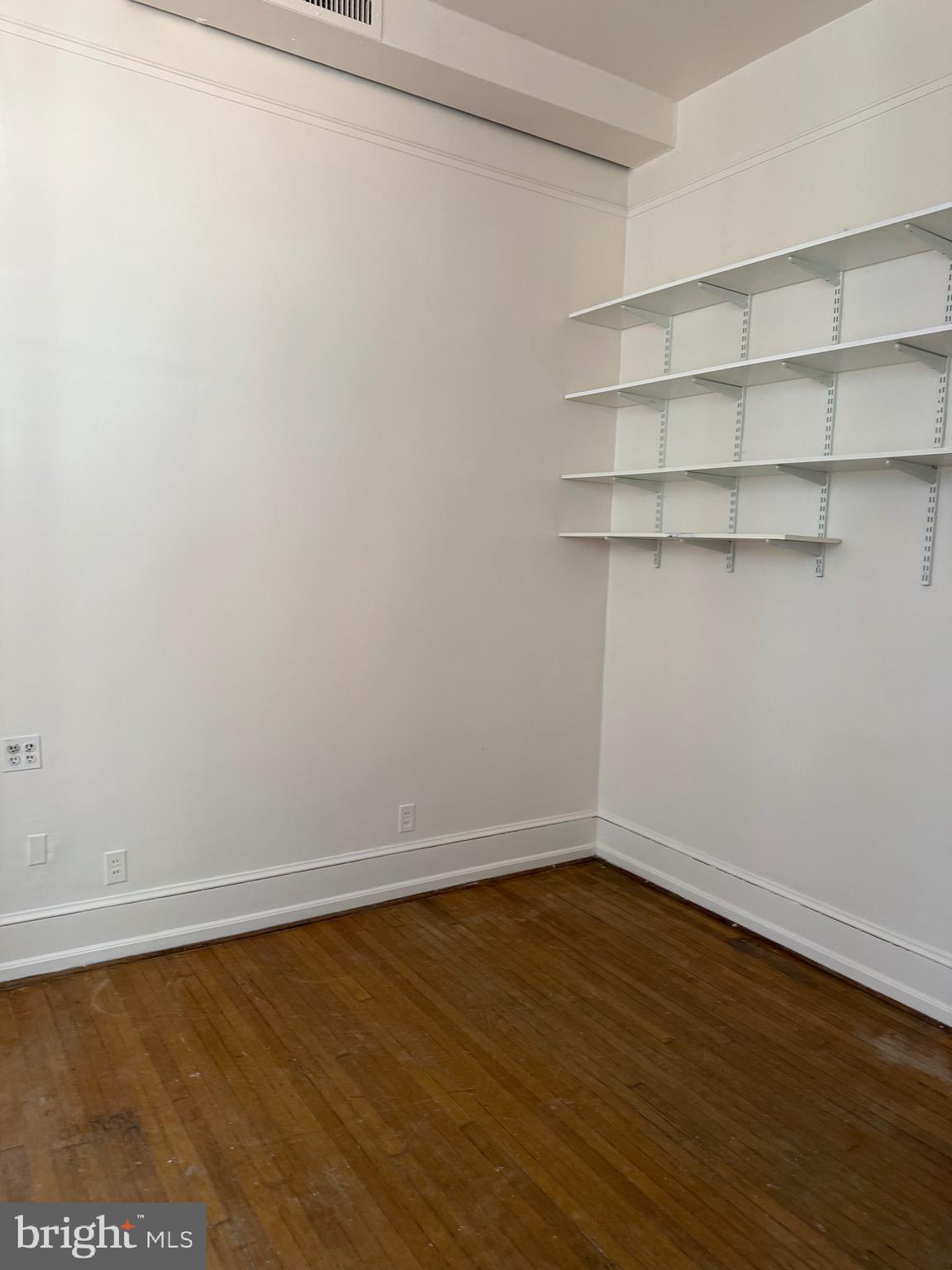 1720 Spruce Street, Unit 5 Philadelphia, PA 19103 - Photo 15 of 24 a view of a room with shelf on the wall